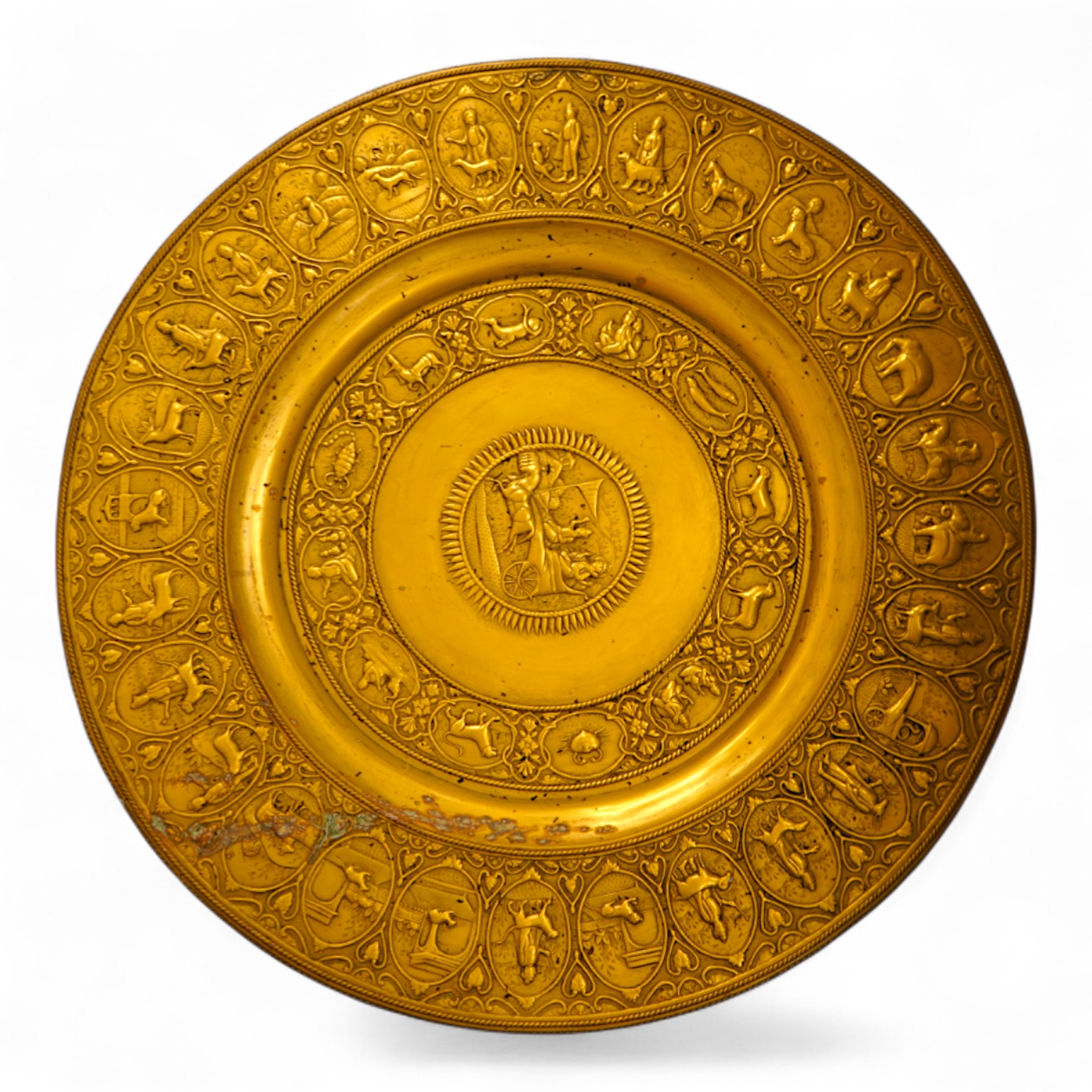 A large early 20th century Indian embossed brass tray, 78cm in diameter